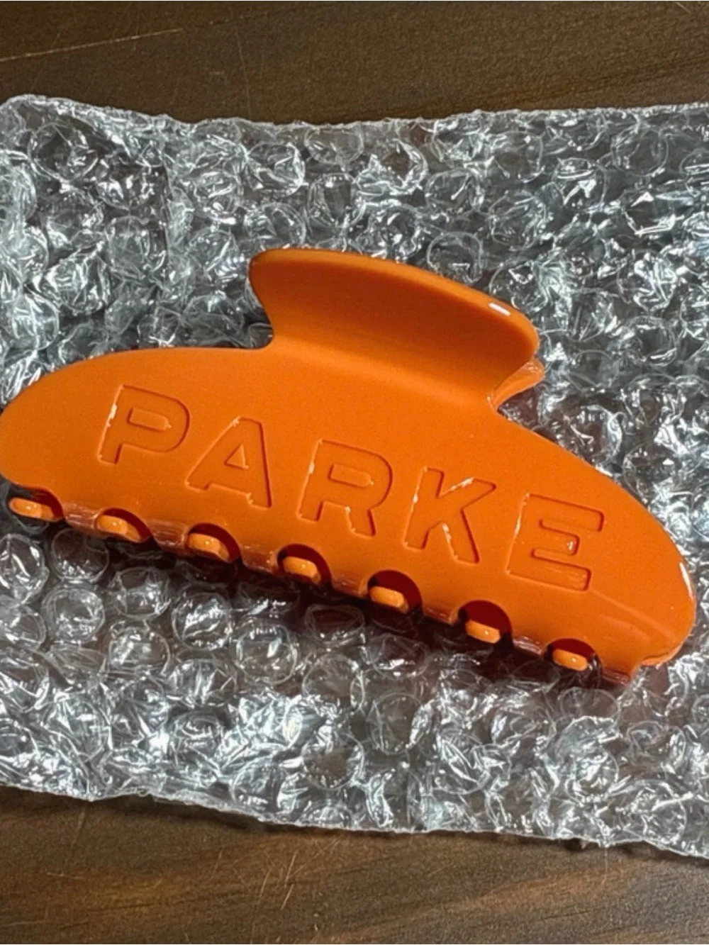 PARKE Orange Hair Claw Clip with Gray Logo Pouch